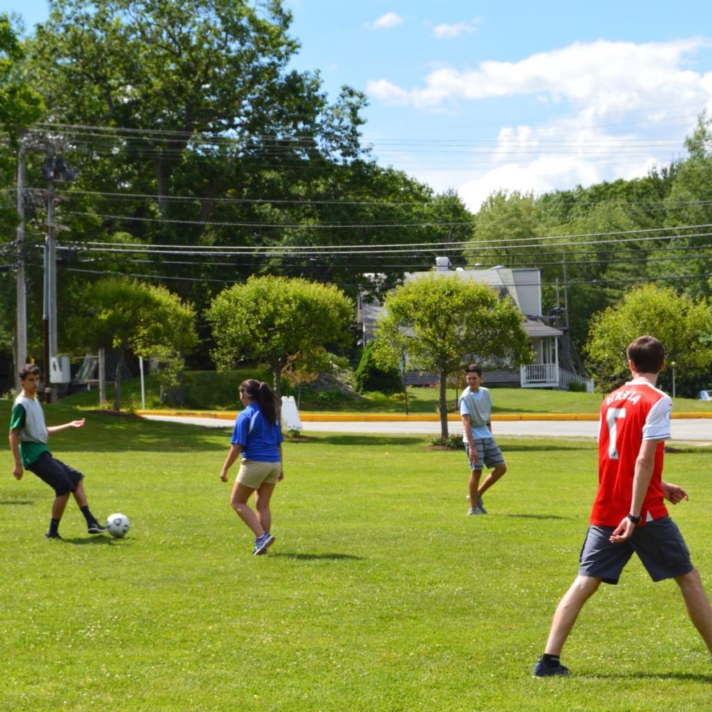 students play soccer outside