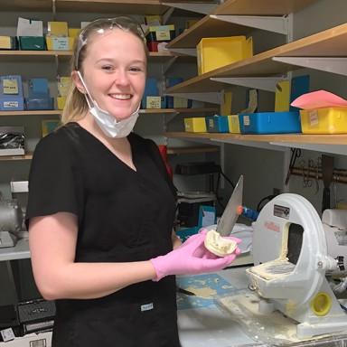 Biological Sciences major Emily Morris interns as a dental assistant